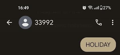 The start of a text message conversation with the number 33992 with the message “HOLIDAY”