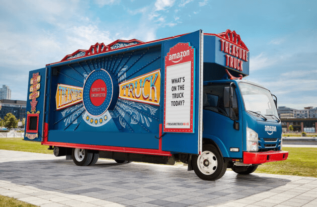 An Amazon Treasure Truck shows a sign with a question reading, "What's on the truck today?"